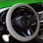 Breathable mesh steering wheel cover in light gray with textured grip and snug fit