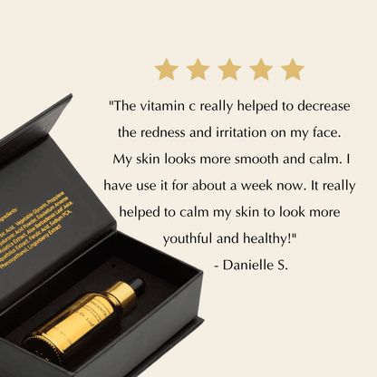 Serum bottle with dropper inside open black gift box