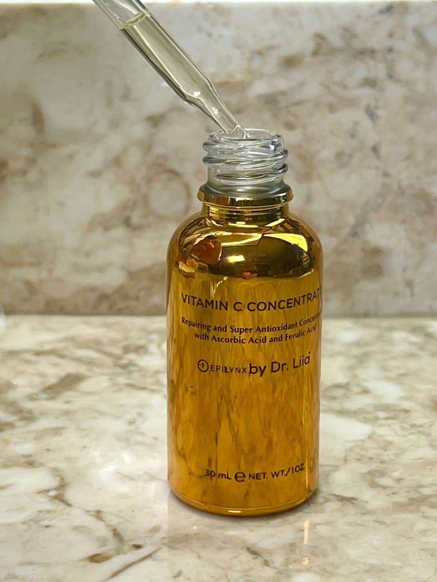 Amber serum bottle with clear glass dropper, gold liquid inside
