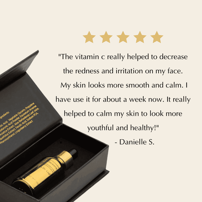 Serum bottle with dropper inside open black gift box