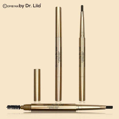 Gold-toned eyebrow pencils with retractable tips and spoolie brush, laid out together