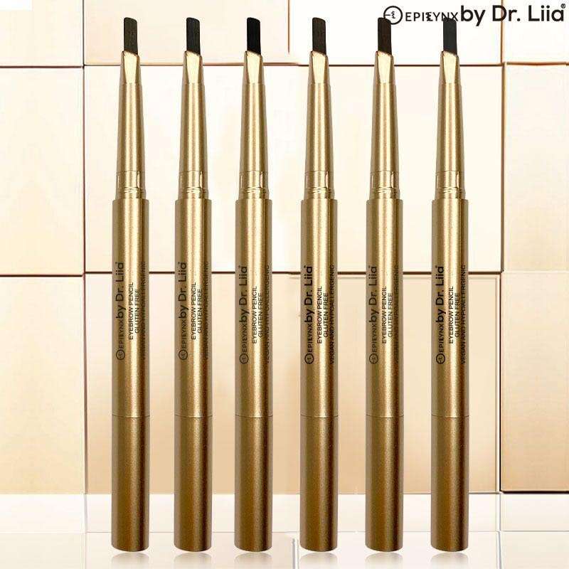 Row of gold-toned eyebrow pencils with black tips and spoolie ends