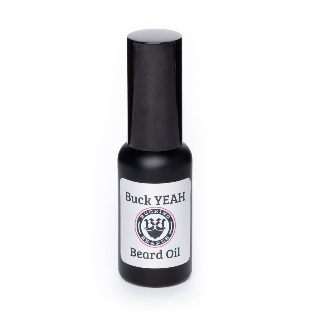 Beard oil bottle with Buck YEAH Beard Oil label and black cap