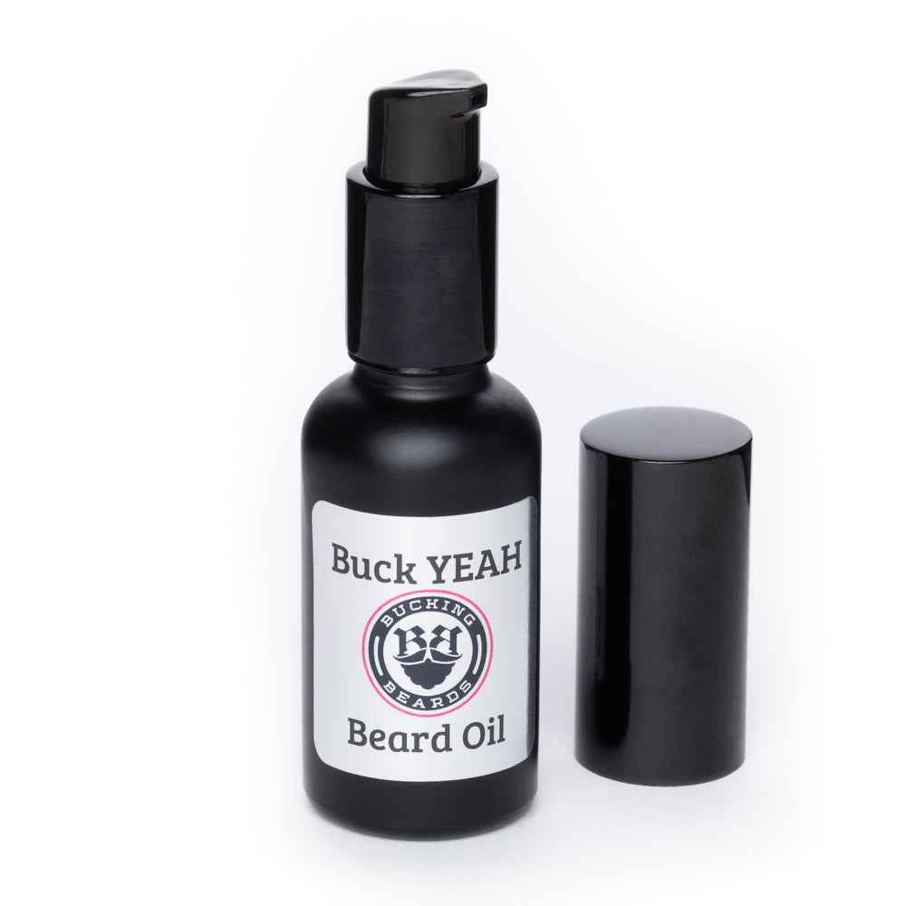 Beard oil bottle with black pump cap; includes a spare cylindrical cap