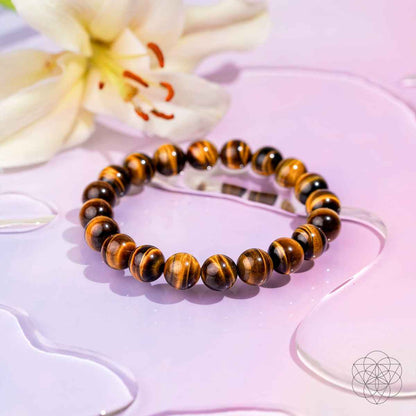 Tiger's eye bead bracelet with round striped amber-brown and black beads.