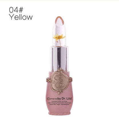 Color-changing flower lip gloss in yellow, clear cap with flower-tip and gold-tone base