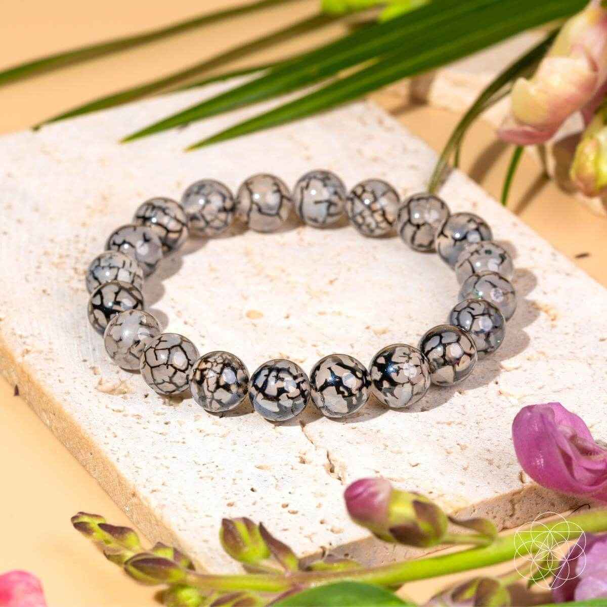River agate beaded bracelet with gray-and-black marbled round stones, elastic stretch fit