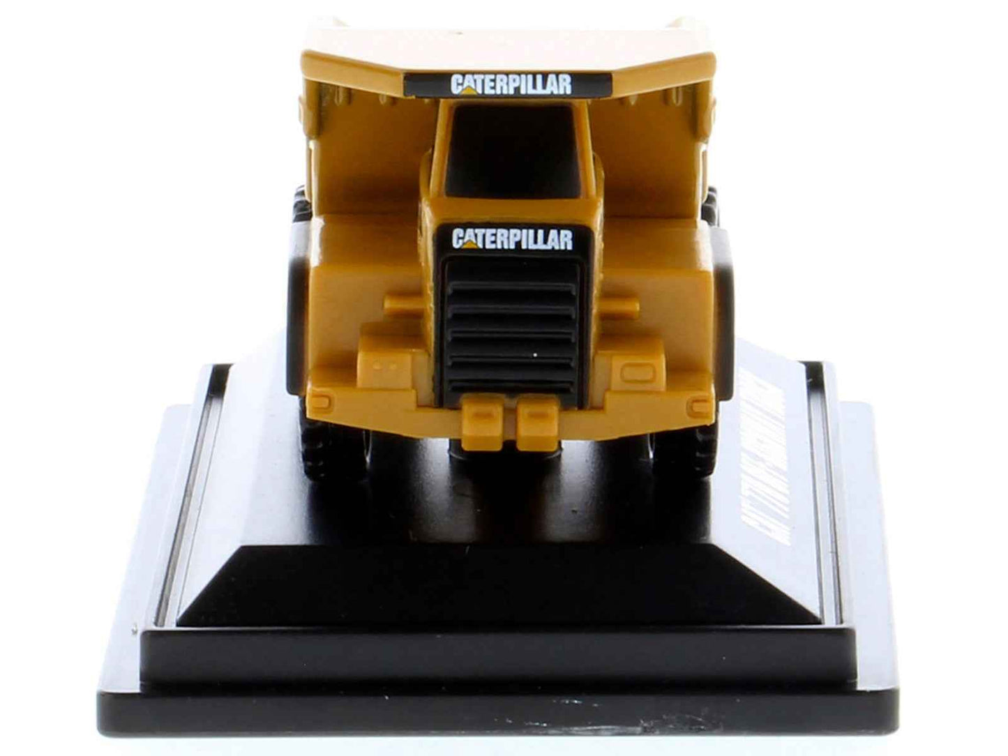 Yellow CAT Caterpillar diecast off-highway truck model with front grille and cab details