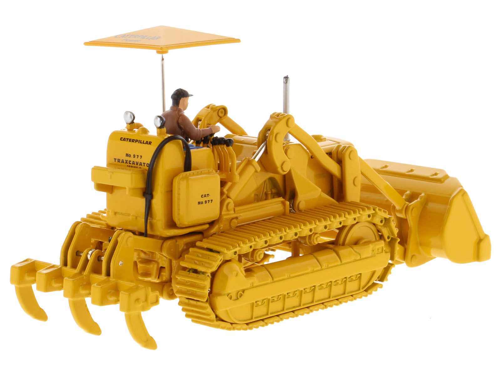Yellow CAT 977D traxcavator diecast model with operator figure and front bucket