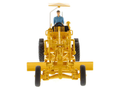 Yellow motor grader diecast front view with seated operator under canopy, large tires