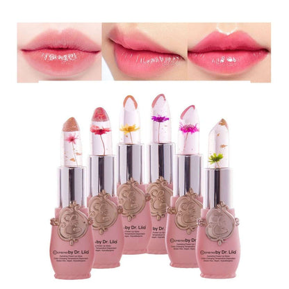 Lip gloss set with swatch lips in pink tones and flower-topped tubes