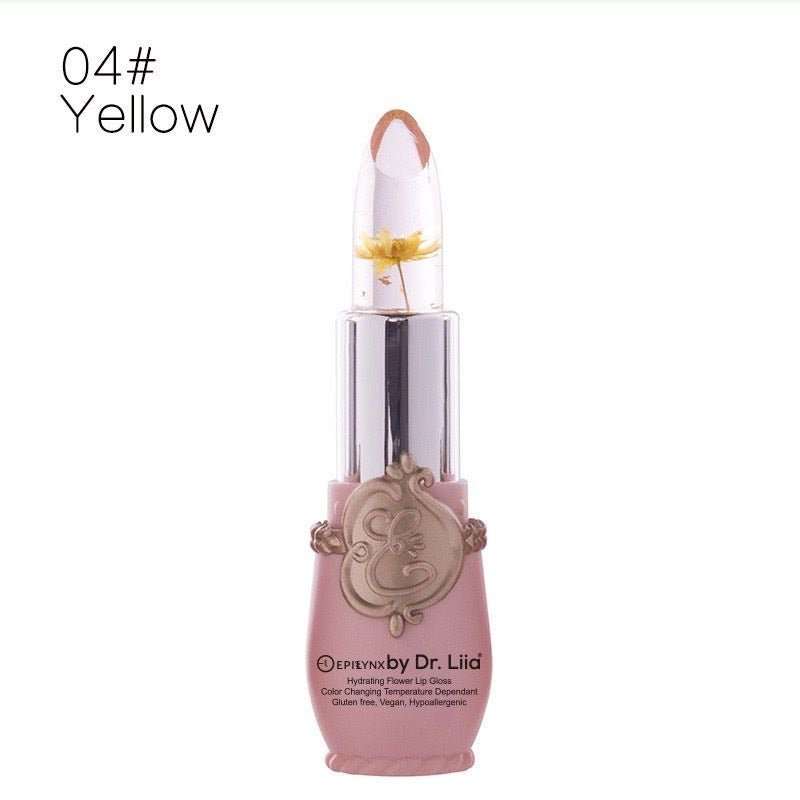 Yellow flower color-changing lip gloss in clear tube with pink base