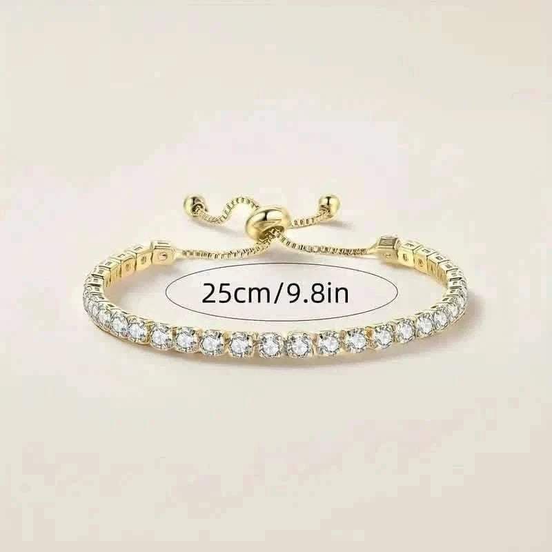 Gold-tone tennis bracelet with clear stones, 25cm/9.8in length mark