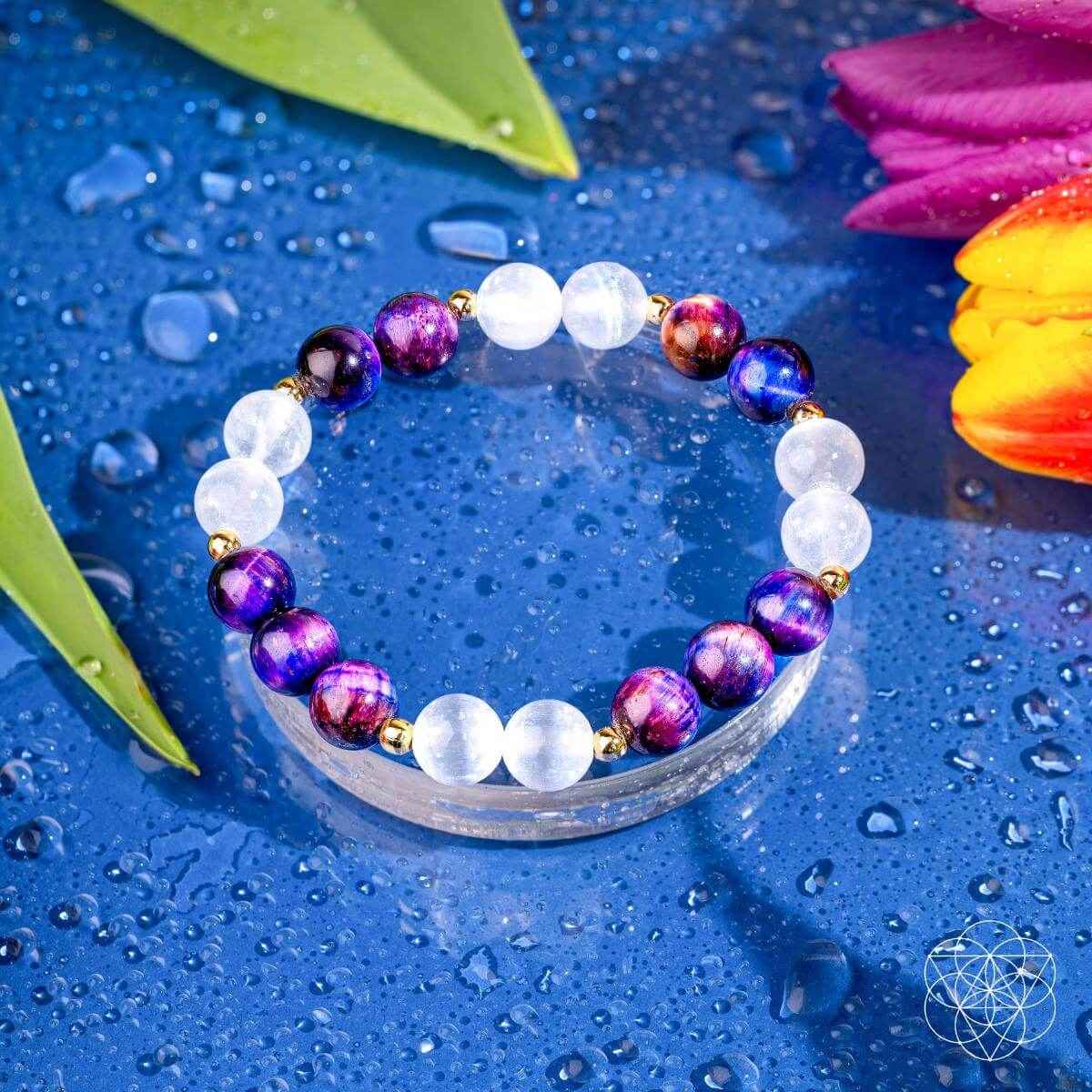 Purple and white gemstone bead bracelet with gold details, round beads