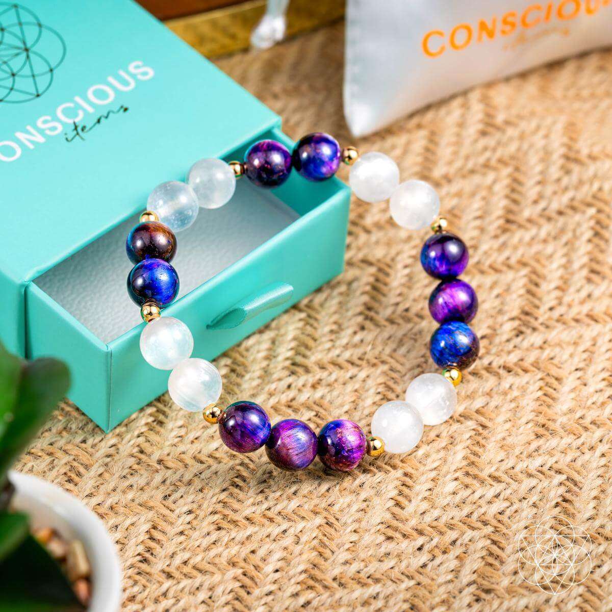 Purple and white gemstone bead bracelet on turquoise gift box, round beads