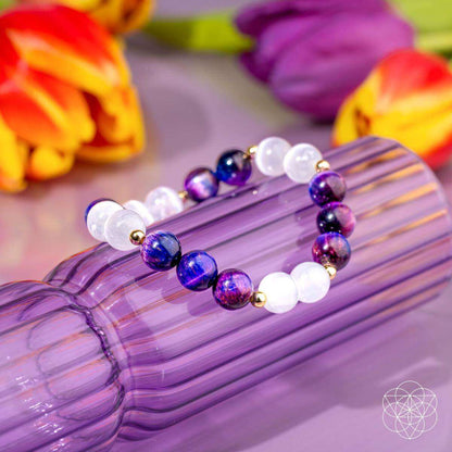 Purple and white gemstone bead bracelet with gold spacers, round beads