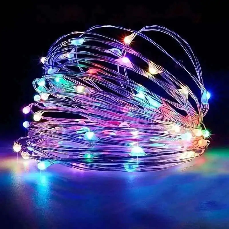 Multicolor LED string lights with rainbow glow, coiled wire.