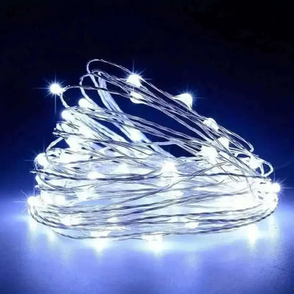 Cool white LED string lights with silver-toned wire, bundled coil.