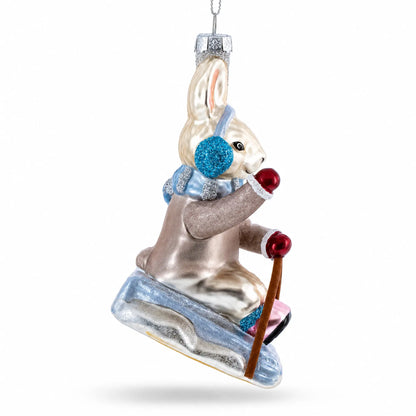 Bunny Sledding with Earmuffs Glass Christmas Ornament