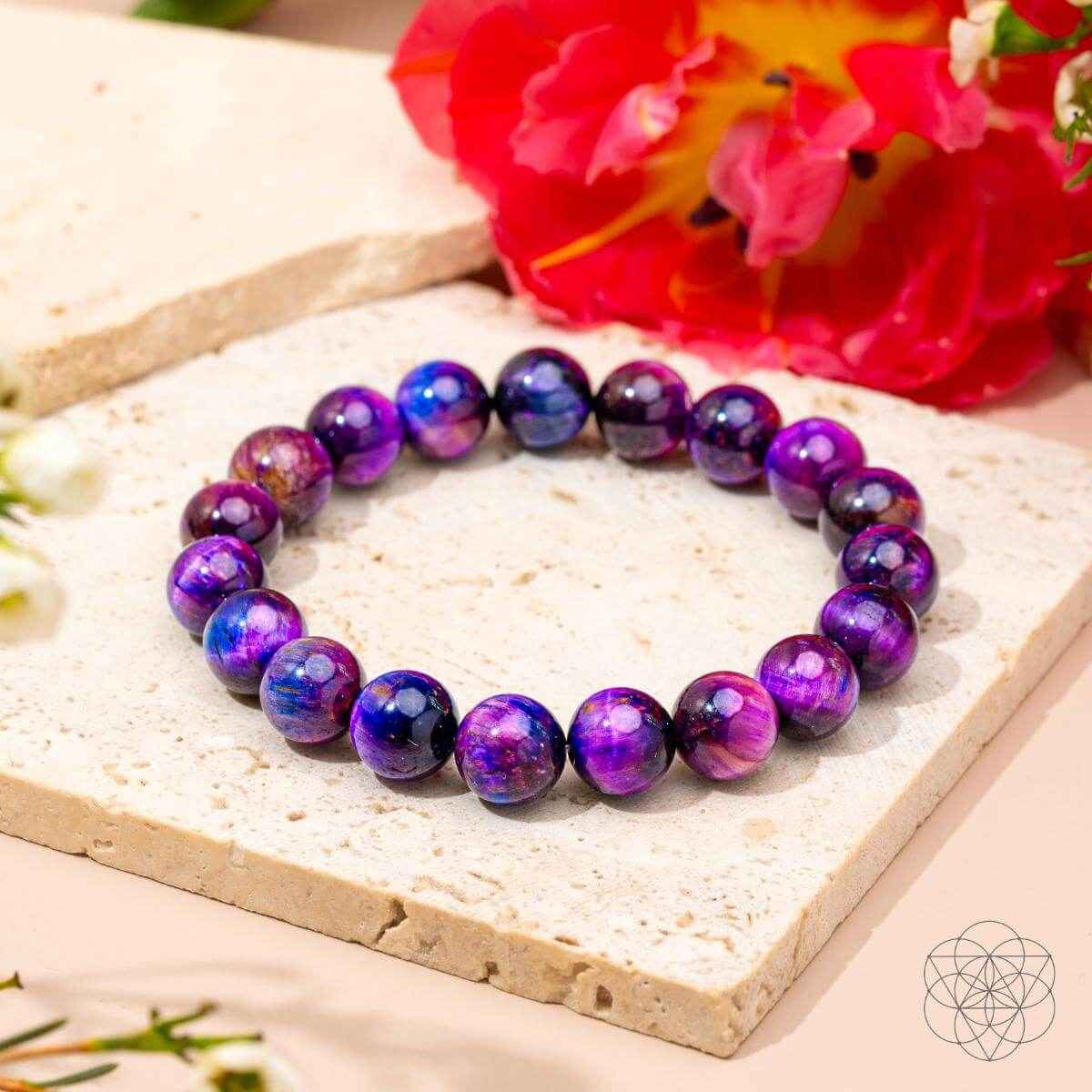 Purple and blue beaded bracelet with round galaxy-look gemstones