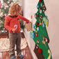 Green felt Christmas tree decoration with colorful holiday ornaments