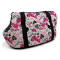 Pet carrier duffel bag with pink heart and paw print pattern, black side straps