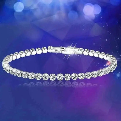 Silver-tone rhinestone tennis bracelet with round stones and link-style band