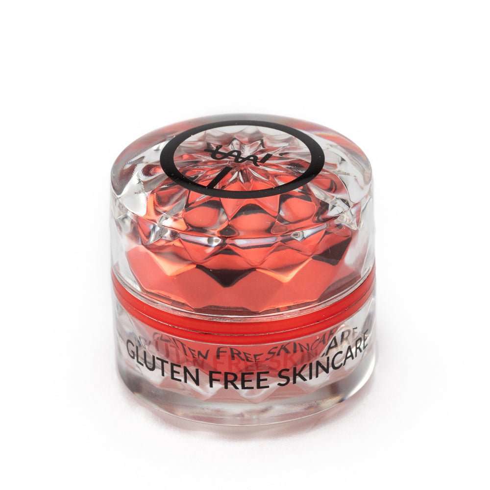 Eye cream jar with red-tinted gel and clear container, gluten-free label