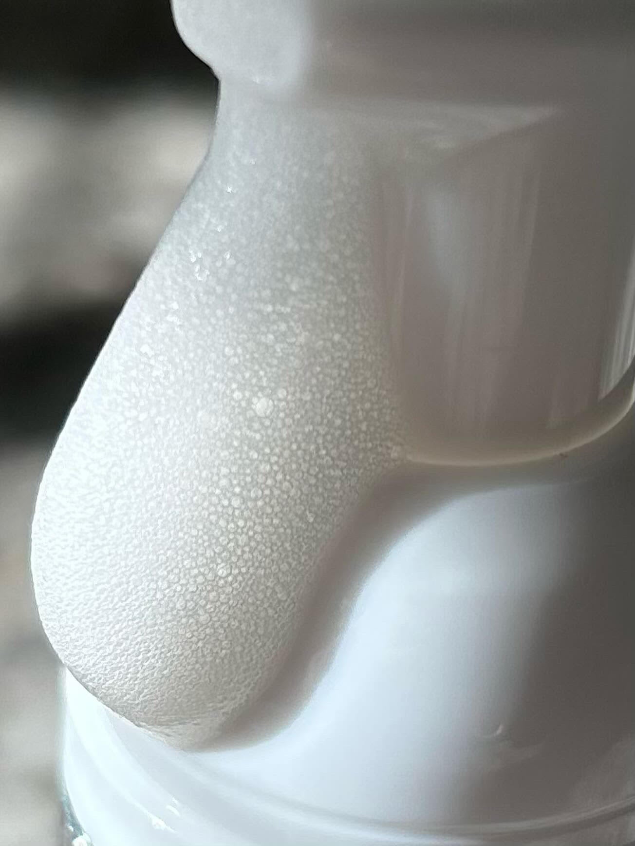 Foaming facial cleanser lather on the skin in a close-up
