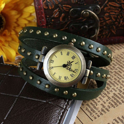 Retro leather belt watch with cream dial, dark green studded leather strap and clasps.