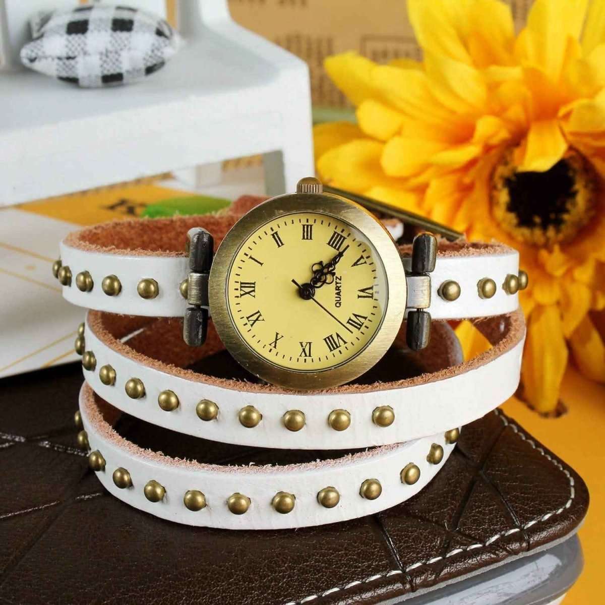 Retro leather belt watch with cream dial, white and brown studded wrap strap.