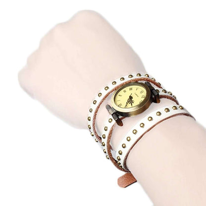 Retro leather belt watch with cream dial, orange leather strap with gold-tone studs.