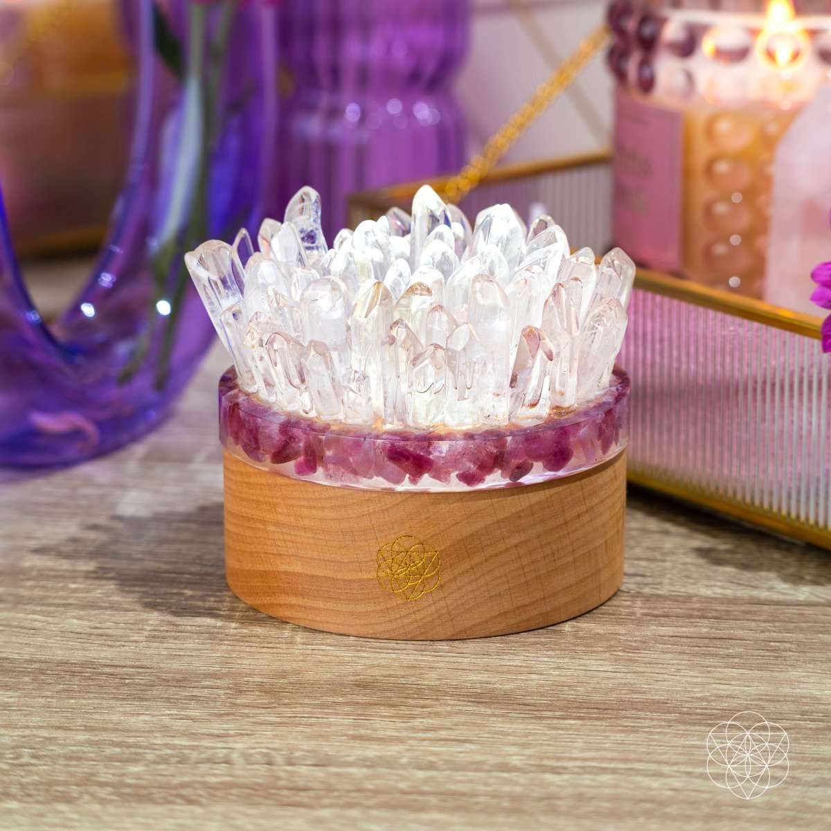 Quartz and tourmaline crystal lamp with clear crystals on wooden base, glowing