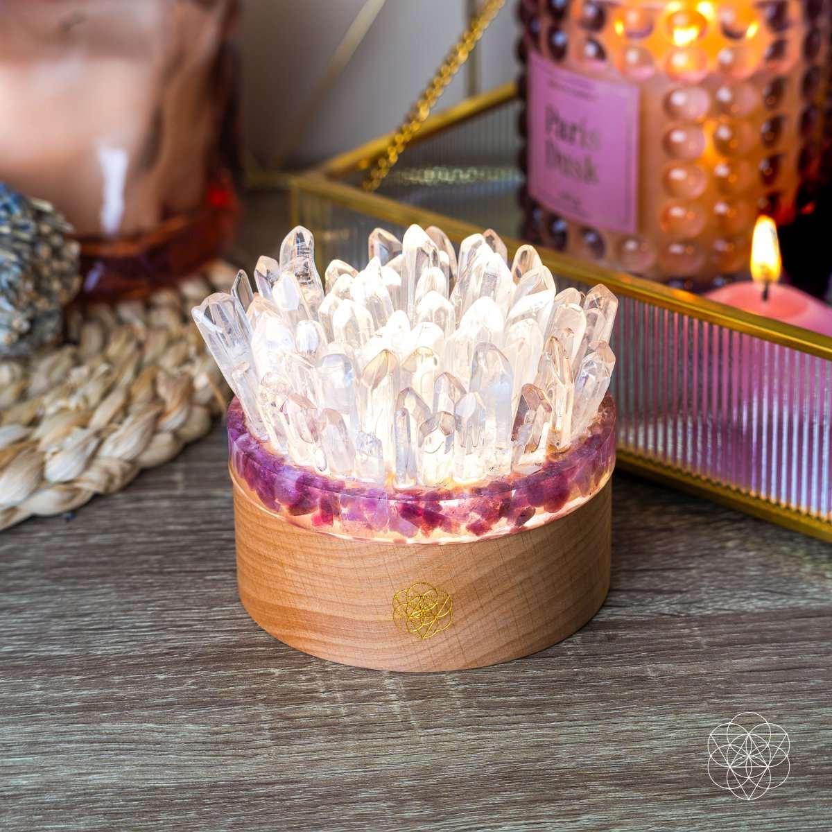 Quartz and tourmaline crystal lamp with clear crystal cluster, wooden base, warm lit glow
