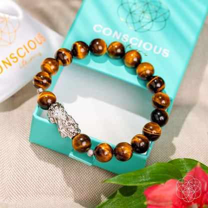 Tiger’s eye bead bracelet with silver Pixiu charm on round tiger-eye beads