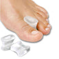 Gel toe separators: two white gel pads separating toes on a bare foot
