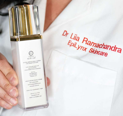 EpiLynx scrub cleanser bottle held beside a Dr Liiia Ramachandra card