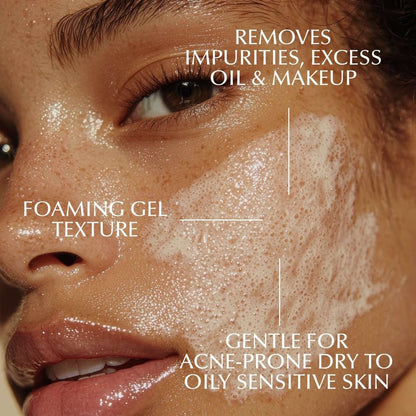Foaming facial cleanser foam near eye and cheek, close-up