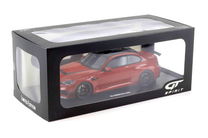 Die-cast car model in a display box with clear window and GT Spirit logo