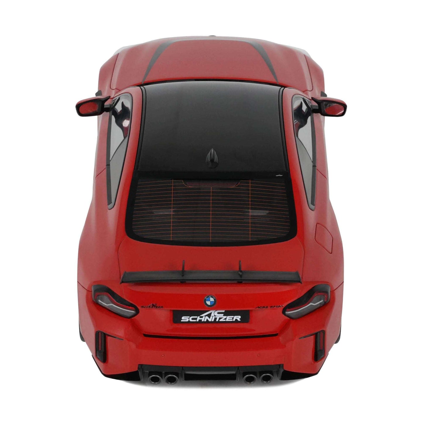 Red die-cast model car rear view with black grille, quad exhaust outlets, SCHNITZER badge