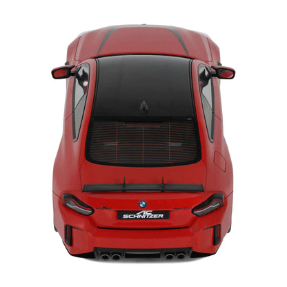 Red die-cast model car rear view with black grille, quad exhaust outlets, SCHNITZER badge