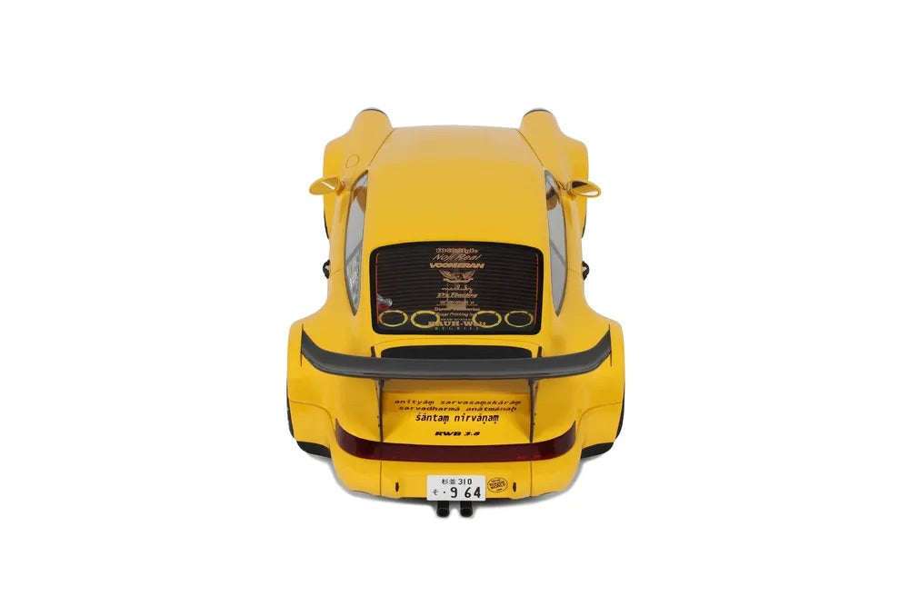 Yellow die-cast model car, rear view with black hood and central detail