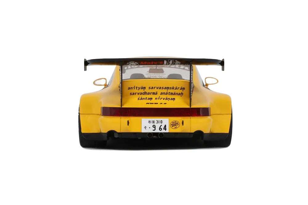 Yellow 1:18 scale Porsche 911 RWB diecast rear view with black diffuser and wing