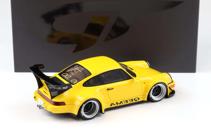 Yellow 1:18 scale Porsche 911 RWB diecast with rear three-quarter view and AMEDEQAM decals