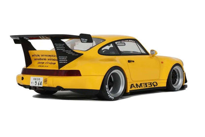 Yellow 1:18 scale Porsche 911 RWB diecast rear three-quarter view with large spoiler