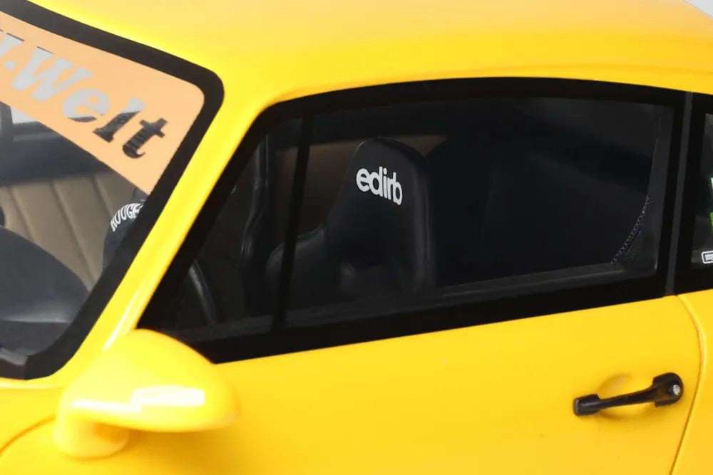 Yellow die-cast model car door and window, "calib" decal and side mirror