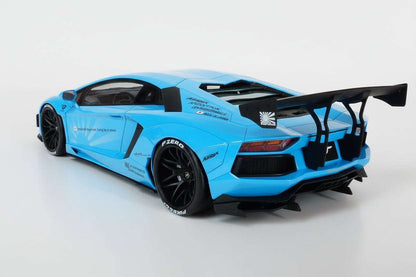 Baby blue die-cast sports car model rear 3/4 view with large wing