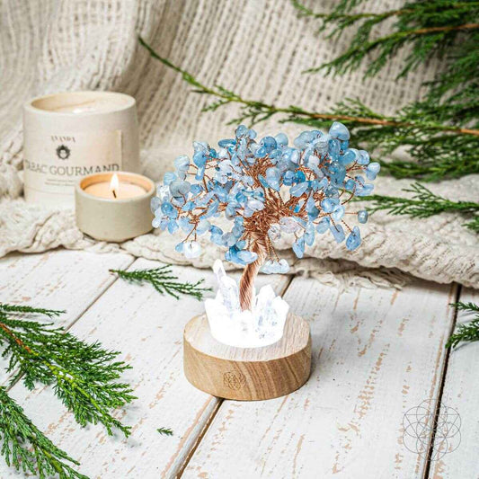 Aquamarine blue crystal tree lamp on round wood base with white crystal accents