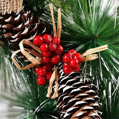 Christmas wreath detail: pine needles with red berry cluster and wooden pinecone charm
