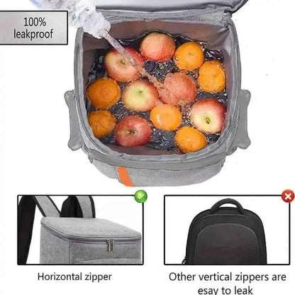 Gray cooler backpack with open insulated compartment holding fruit, zipper top.